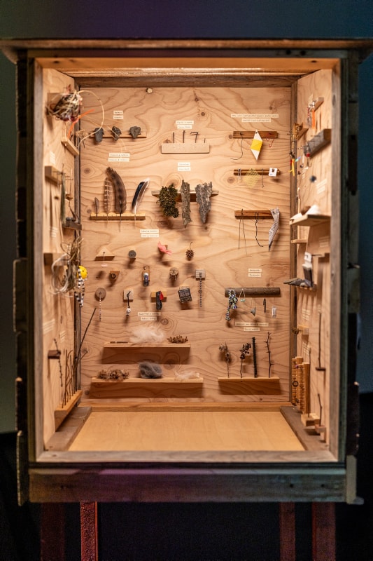 Interior view of a wooden artwork featured in the exhibition