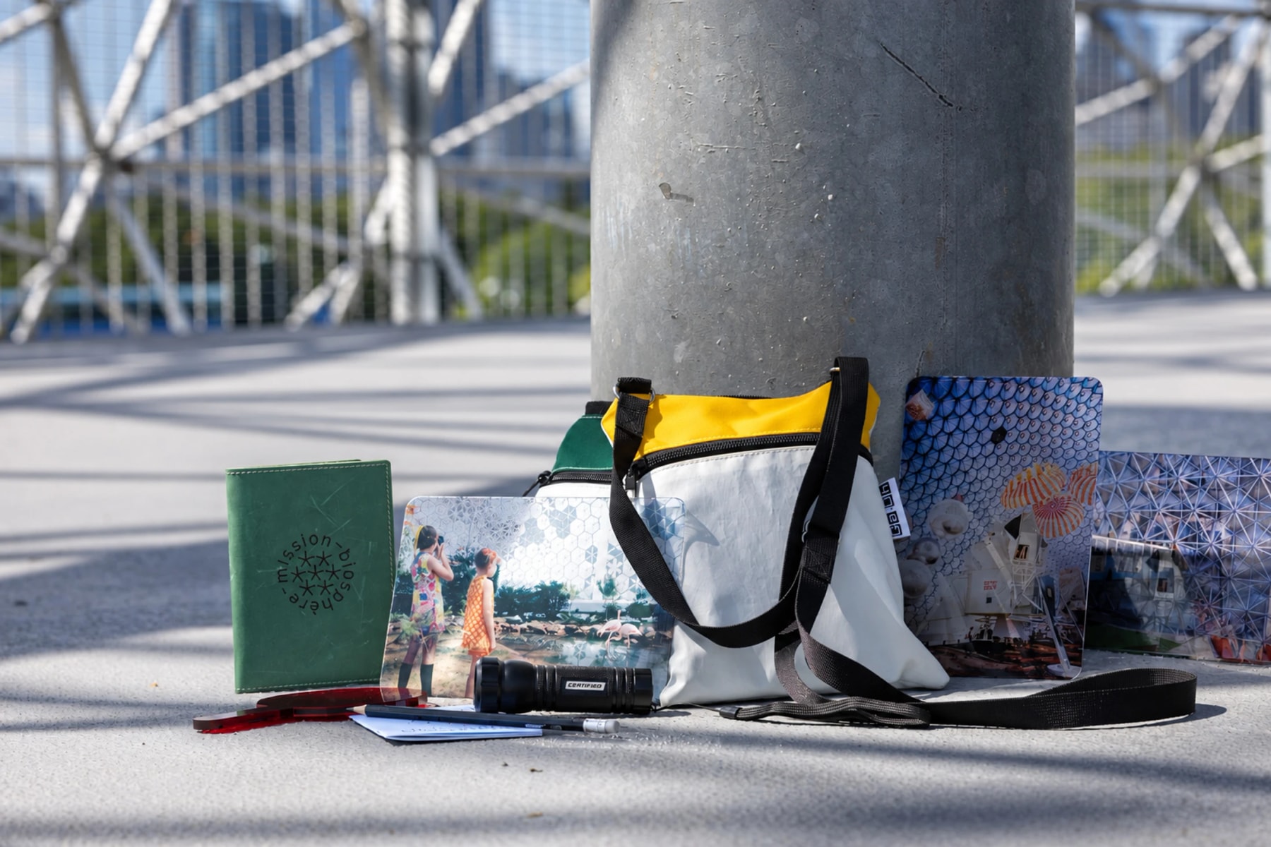 An activity bag, booklet and photographs arranged inside the Biosphère.
