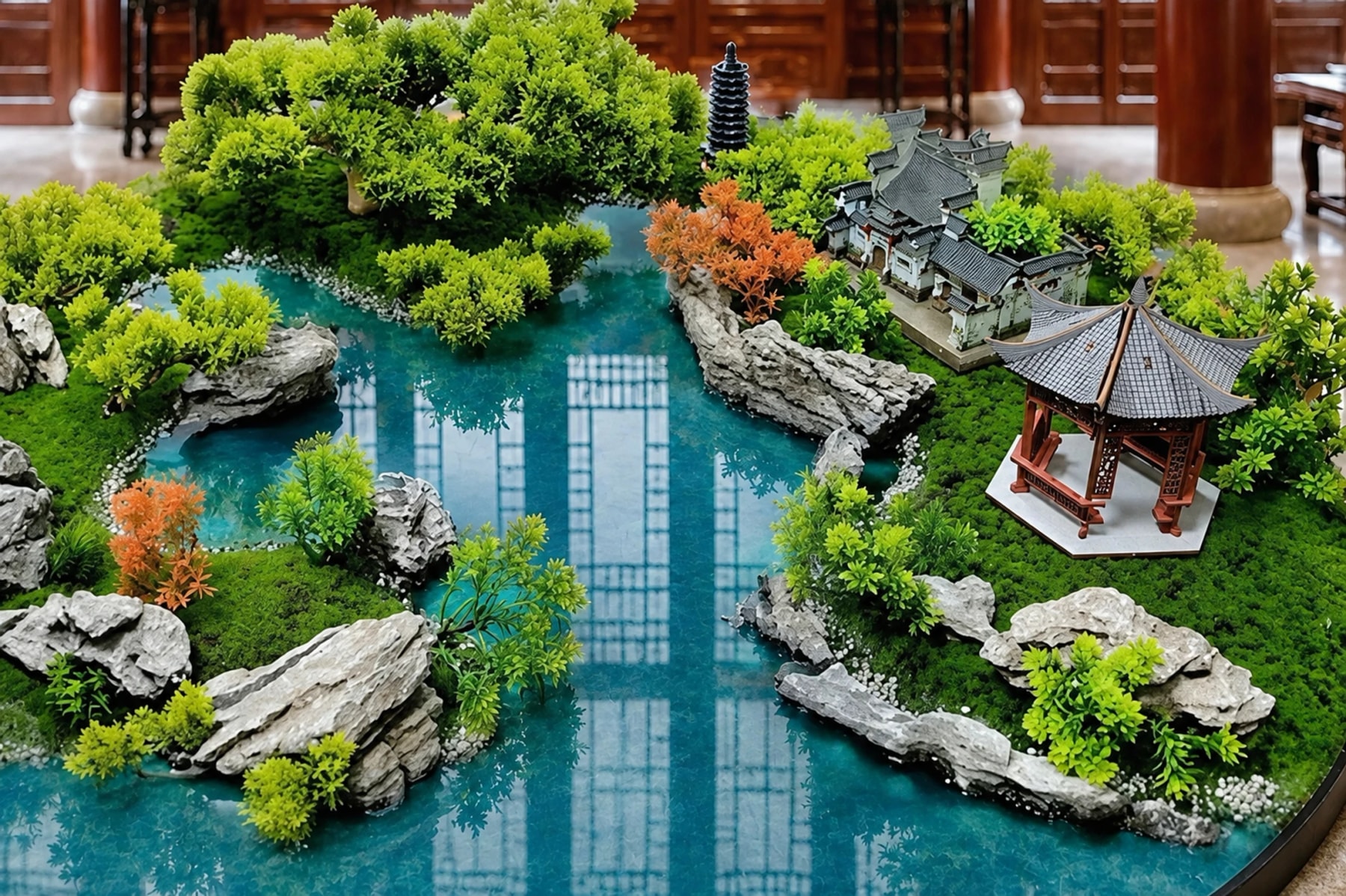A miniature landscape with trees, rocks and Chinese pavilions around a pond.